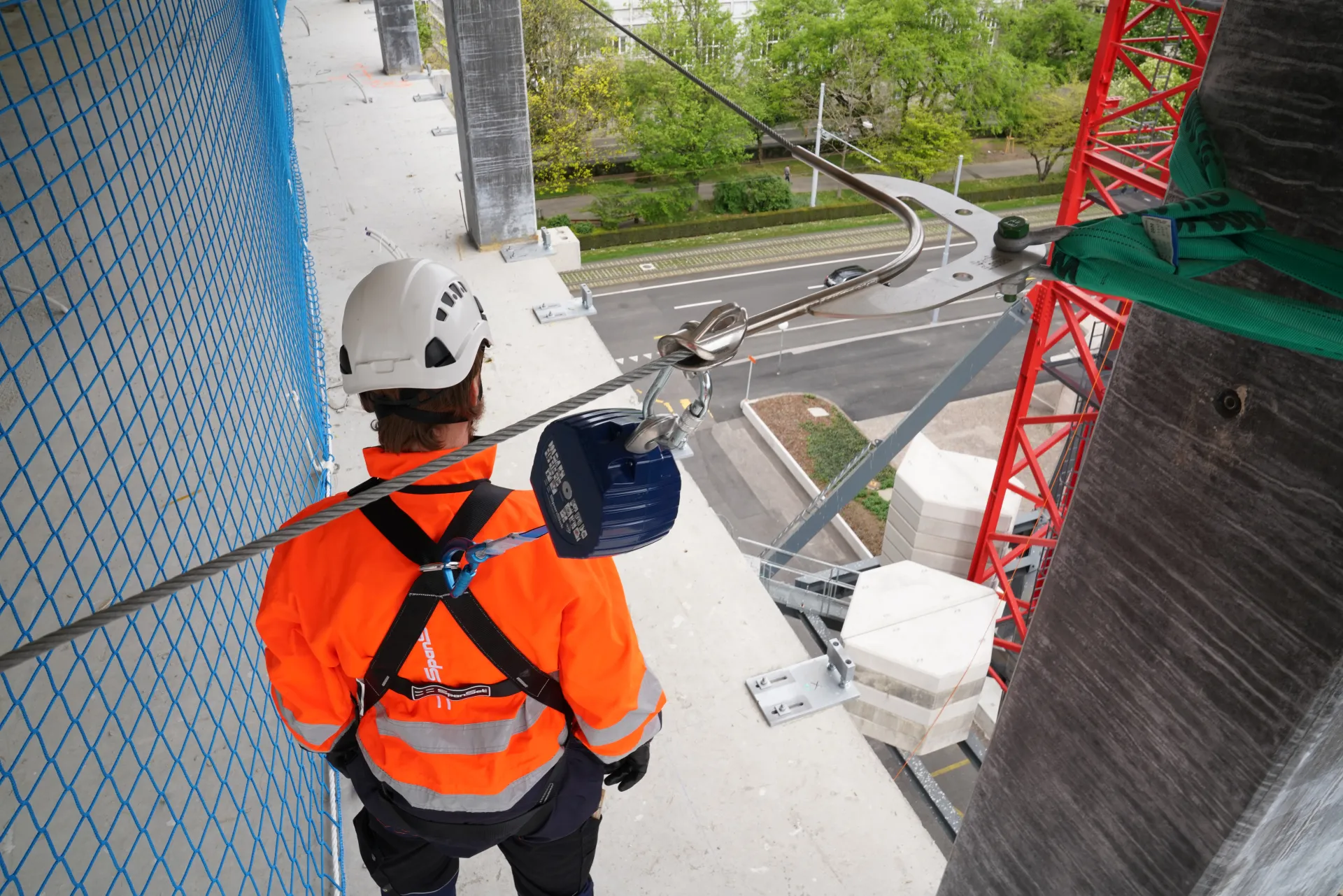 Worker with safety harness and SRL while working at heights 